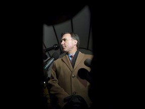 Minister of Finance Bill Morneau speaks to reporters as he arrives at 7 Rideau Gate for a working dinner with provincial and territorial finance ministers, on Sunday, Dec. 18, 2016. THE CANADIAN PRESS/Justin Tang ORG XMIT: JDT111