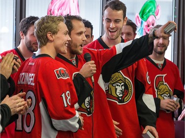 Frederik Claesson leads the team in singing a carol as the Ottawa Senators make their annual Christmas visit to CHEO and visit with some of the children and staff. They also brought gifts including a DSLR camera, video games, movies, blankets and plush Sparty dolls for CHEO's use in its effort to enhance the lives of hospital patients.