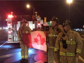 Ottawa firefighters honour Capt. Thomas McQueen as his body is brought in a procession to Ottawa for burial.