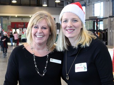 From left, Caring and Sharing Exchange executive director Cindy Smith with Ottawa MP Catherine McKenna at the Hamper Packing Day held at the Horticulture Building at Lansdowne on Wednesday, December 21, 2016, in support of the nonprofit's Christmas Exchange Program  to provide food hampers to individuals and families in need.