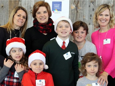 From left, Julie Taggart and her daughter Ella Edmondson and son, Connor Edmondson, along with Tracy Rait-Parkes and her son, Jack, Ethan Edmondson, and Michelle Taggart with her daughter, Lucy, all of whom helped to volunteer, on behalf of the Taggart Parkes Foundation, at the Hamper Packing Day held at the Horticulture Building at Lansdowne on Wednesday, December 21, 2016.