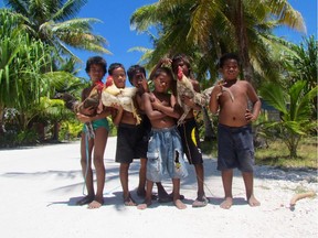 Children on the beaches of Kiribati. The Pacific Island faces myriad challenges, climate change among them.