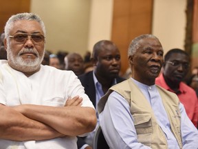 Former Ghanaian President Jerry Rawlings (L) and former South African President and head of African Union mornitoring group Thabo Mbeki look on as presidential candidates sign peace pact ahead of the Dec. 7 polls in Accra.