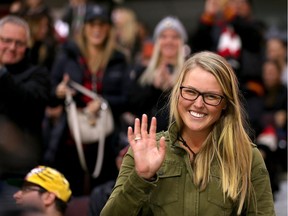 Golfer Brooke Henderson acknowledges the crowd during the first period as the Ottawa Senators take on the Florida Panthers in NHL action at Canadian Tire Centre.