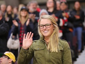 Golfer Brooke Henderson acknowledges the crowd during the first period as the Ottawa Senators take on the Florida Panthers in NHL action at Canadian Tire Centre.