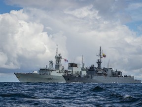 Her Majesty’s Canadian Ship (HMCS) FREDERICTON and the Colombian Navy Ship ALMIRANTE PADILLA fly their battle ensigns while sailing in formation off the coast of Cartagena, Colombia on November 28, 2016. Photo: Corporal Kenneth Galbraith.