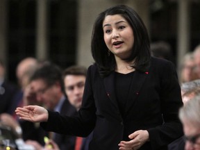 Maryam Monsef, Minister of Democratic Institutions, stands in the House of Commons during question period in Ottawa, Friday, December 2, 2016.