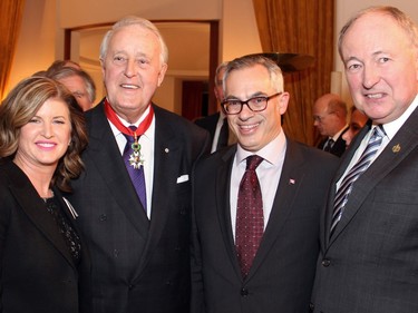 Interim Conservative Party leader and Official Opposition leader Rona Ambrose with Brian Mulroney, Parry Sound-Muskoka MP and Official Opposition Public Safety critic Tony Clement, and Niagara Falls MP and Official Opposition Justice critic Rob Nicholson at the Embassy of France on Tuesday, December 6, 2016, for Mulroney's induction into the French Legion of Honour.