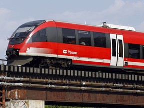 The O-Train crosses a bridge near Carleton University.