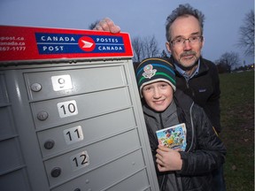 Kevin Boyce's family, seen here with his son Finlay, 12, have been locked out of their Canada Post super mailbox for more than a month.