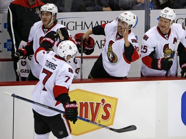 The Ottawa Senators' Kyle Turris returns to the bench to celebrate after his goal in the first period.