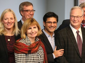 Liberals Catherine McKenna (from left) Nathalie Des Rosiers, Jim Watson, Yasir Naqvi and John Fraser (far right) join with Dr Jack Kitts (second from right) as the provincial government announces funding for the next stage of planning for the new the Ottawa Hospital, Civic Campus at the former Sir John Carling Building site on the Experimental Farm.