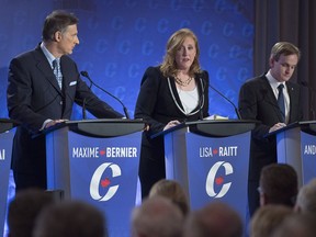 Lisa Raitt is flanked by Maxime Bernier, left, and Andrew Saxton at the Conservative leadership candidates' bilingual debate in Moncton, N.B. on Tuesday, Dec. 6, 2016. Conservatives vote for a new party leader on May 27, 2017.