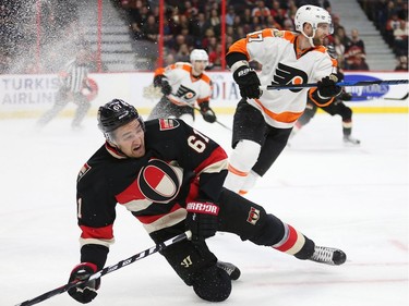 Mark Stone is upended in the first period as the Ottawa Senators take on the Philadelphia Flyers in NHL action at Canadian Tire Centre.