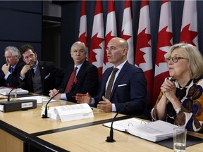 Members of the House of Commons special committe on electoral reform Luc Therault Bloc Quebecois, left to right, Scott Reid Conservative Party, Francis Scarpaleggia Liberal Party, Nathan Cullen NDP, and Elizabeth May Green Party hold a news conference in Ottawa, Thursday, Decemeber 1, 2016. A special all-party committee is recommending that the Trudeau government design a new proportional voting system and hold a national referendum to gauge how much Canadians would support it.