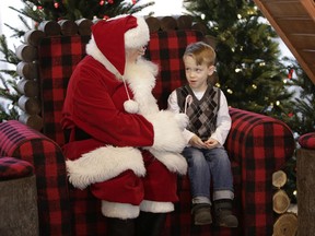 Nolan, who is autistic, visits with Santa as part of the Sensory Santa program, at the Rideau Centre in Ottawa on Dec. 4, 2016. This is the third year of the program organized by QuickStart which allows families to bring their autistic children to visit Santa for a photo during designated hours when the crowds and noise are at a minimum. (David Kawai)
