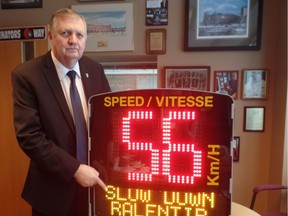Orléans Coun. Bob Monette with a speed board. Nineteen of the speed boards will go up in Orléans ward, Monette says. (Supplied photo)