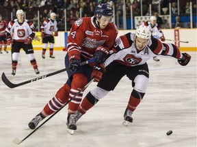 The Ottawa 67's Ryan Orban checks the Oshawa Generals' Grayden Gottschalk during first-period OHL action at the TD Place arena on Friday, Dec. 30, 2016.