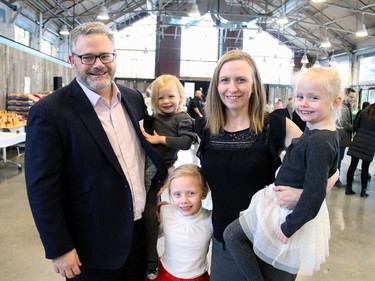 Ottawa lawyer Paul Lalonde, board president of the Caring and Sharing Exchange, recruited his wife Jen and their three daughters, Elsie, two, Isabelle, six, and Isla, four, to help volunteer at the Hamper Packing Day, held at the Horticulture Building at Lansdowne on Wednesday, December 21, 2016, in support of the non-profit organization's Christmas Exchange Program.