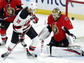 Ottawa Senators goaltender Mike Condon makes a save on the New Jersey Devils' Travis Zajac during the third period.