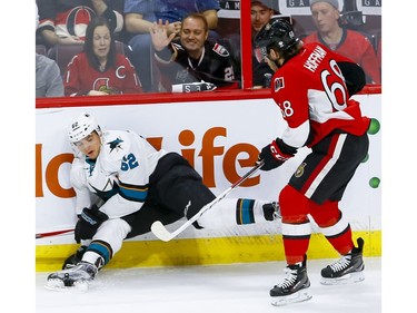 Ottawa Senators left wing Mike Hoffman (68) checks San Jose Sharks right wing Kevin Labanc (62) during NHL action at the Canadian Tire Centre on Wednesday December 14, 2016.