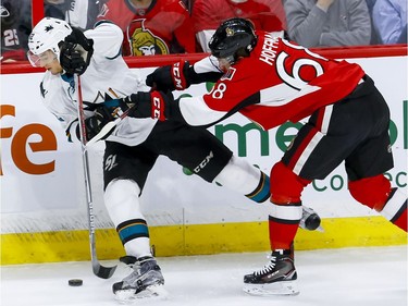 Ottawa Senators left wing Mike Hoffman (68) checks San Jose Sharks right wing Kevin Labanc (62) during NHL action at the Canadian Tire Centre on Wednesday December 14, 2016.