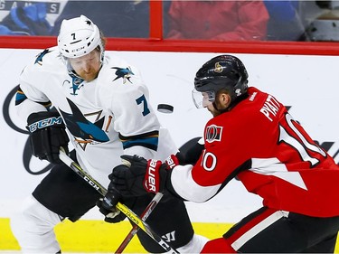 Ottawa Senators left wing Tom Pyatt (10) and San Jose Sharks defenseman Paul Martin (7) battle for a loose puck during NHL action at the Canadian Tire Centre on Wednesday December 14, 2016. Errol McGihon/Postmedia
