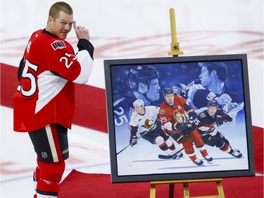 Ottawa Senators right wing Chris Neil (25) acknowledges the crowd during a ceremony to celebrate his 1000th NHL game prior to the game against the San Jose Sharks at the Canadian Tire Centre on Wednesday December 14, 2016. Errol McGihon/Postmedia