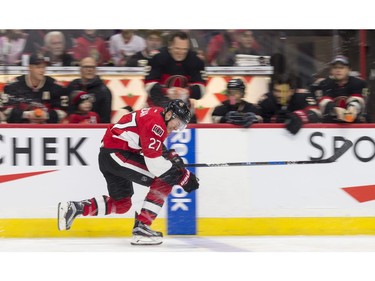 Ottawa Senators right wing Curtis Lazar gets sprayed with a water bottle by Team Chris Neil as he passes their bench while competing in the fastest skater event.