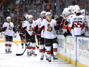 Ryan Dzingel #18 of the Ottawa Senators is congratulated by teammates after scoring a goal during the first period of a game against the Anaheim Ducks at Honda Center on December 11, 2016 in Anaheim, California.