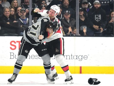 Chris Neil of the Ottawa Senators, playing in his 1,000th NHL game, fights with Jordan Nolan of the Los Angeles Kings.