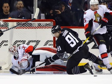 NEW YORK, NY - DECEMBER 18:  Andrew Hammond #30 of the Ottawa Senators is injured during the first period as he makes the save on John Tavares #91 of the New York Islanders at the Barclays Center on December 18, 2016 in the Brooklyn borough of New York City.