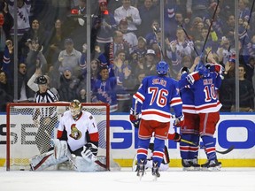Nick Holden of the New York Rangers celebrates his game-winning goal against Mike Condon. The Rangers defeated the Senators 4-3.