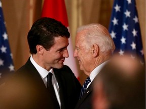 Prime Minister Justin Trudeau and U.S. Vice-President Joe Biden share words at an official dinner Thursday, December 8, 2016, at the Sir John A. Macdonald Building in Ottawa.