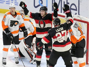 Ryan Dzingel celebrates his goal with Curtis Lazar in the second period as the Ottawa Senators take on the Philadelphia Flyers in NHL action at Canadian Tire Centre.