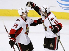 Ottawa Senators' Derick Brassard (19) celebrate his goal with Ryan Dzingel during the second period of an NHL hockey game against the Chicago Blackhawks, Tuesday, Dec. 20, 2016, in Chicago.