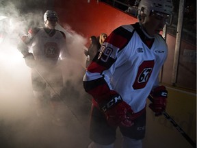 Sasha Chmelevski (right) of the Ottawa 67's makes his way to the ice to play the Kitchener Rangers at TD Place Saturday December 3, 2016.  Ashley Fraser/Postmedia