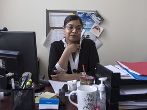 Dying with Dignity Canada's CEO Shanaaz Gokool sits in her office following a news conference in response to new federal legislation on physician-assisted dying, in Toronto, on Thursday, April 14, 2016.