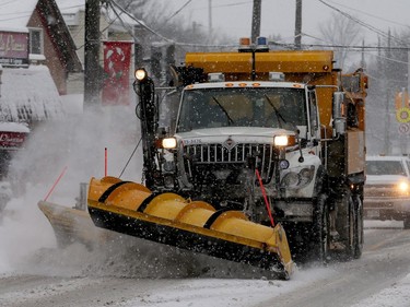 Snowplows were out in full force Monday morning following 15 centimetres of snow, slowing the roads and early-morning commute.