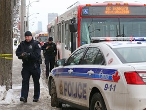 Police investigate the scene where a stabbing victim took refuge in an OC Transpo bus Tuesday.