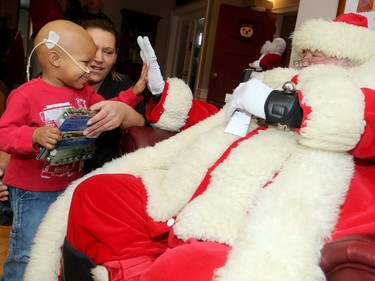 The big jolly fella arrived at Ronald McDonald House Thursday (Dec. 15/2016) as the United States Marine Corp. and US. Navy brought hundreds of toys for sick kids along with American ambassador, Bruce Heyman. Here, Santa gets a high five from Kegan McPherson, 2 1/2,  who's undergoing treatment for neuroblastoma at CHEO.