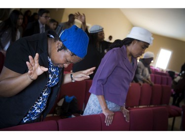 The congregation at a Bible Way Ministries service on Sunday remembered two teenage sisters killed in a crash Friday.