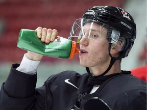 Ottawa Senators draft pick Thomas Chabot takes a drink at the world junior selection camp in Boisbriand, Que. On Monday, he was named an alternate captain for the team.