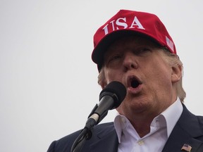 US President-elect Donald Trump addresses a 'Thank You Tour 2016' rally on December 17, 2016 in Mobile, Alabama.  /