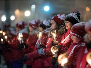 Youth participants hold torches during the Fire of Friendship Relay as part of a New Year's Eve celebration in Ottawa.