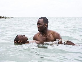 This image released by A24 shows Alex Hibbert, foreground, and Mahershala Ali in a scene from the film, &ampquot;Moonlight.&ampquot; The Producers Guild of America has nominated awards season favorites ‚ÄúLa La Land,‚Äù ‚ÄúMoonlight‚Äù and ‚ÄúManchester by the Sea‚Äù for its top award, as well as the R-rated superhero film ‚ÄúDeadpool.‚Äù Winners will be announced in a Jan. 28 ceremony in Beverly Hills, Calif. (David Bornfriend/A24 via AP)