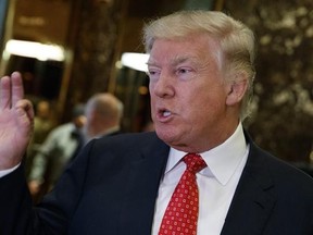 FILE - In this Jan. 9, 2017 file photo, President-elect Donald Trump talks with reporters at Trump Tower in New York. As a businessman, Trump has kept the courts busy. That is not likely to end when he enters the Oval Office, creating an unusual and potentially looming problem for a sitting president. (AP Photo/Evan Vucci, File)