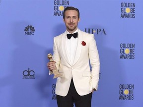 Ryan Gosling poses in the press room with the award for best performance by an actor in a motion picture - musical or comedy for &ampquot;La La Land&ampquot; at the 74th annual Golden Globe Awards at the Beverly Hilton Hotel on Sunday, Jan. 8, 2017, in Beverly Hills, Calif. THE CANADIAN PRESS/AP-Photo by Jordan Strauss/Invision/AP