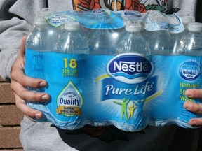 A package of Nestle bottled water is shown in Oakville, Ont., on Friday, Oct. 14, 2016. The Canadian Press has learned that Ontario is proposing to charge water-bottling companies a little over $500 per million litres, up from the current fee of just a few dollars. THE CANADIAN PRESS/Richard Buchan