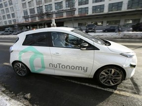 In this Tuesday, Jan. 10, 2017, photo, an autonomous vehicle is driven by an engineer on a street through an industrial park, in Boston. Researchers at Massachusetts Institute of Technology are asking human drivers how they&#039;d handle life-or-death decisions in hopes of creating better algorithms to guide autonomous vehicles. (AP Photo/Steven Senne)